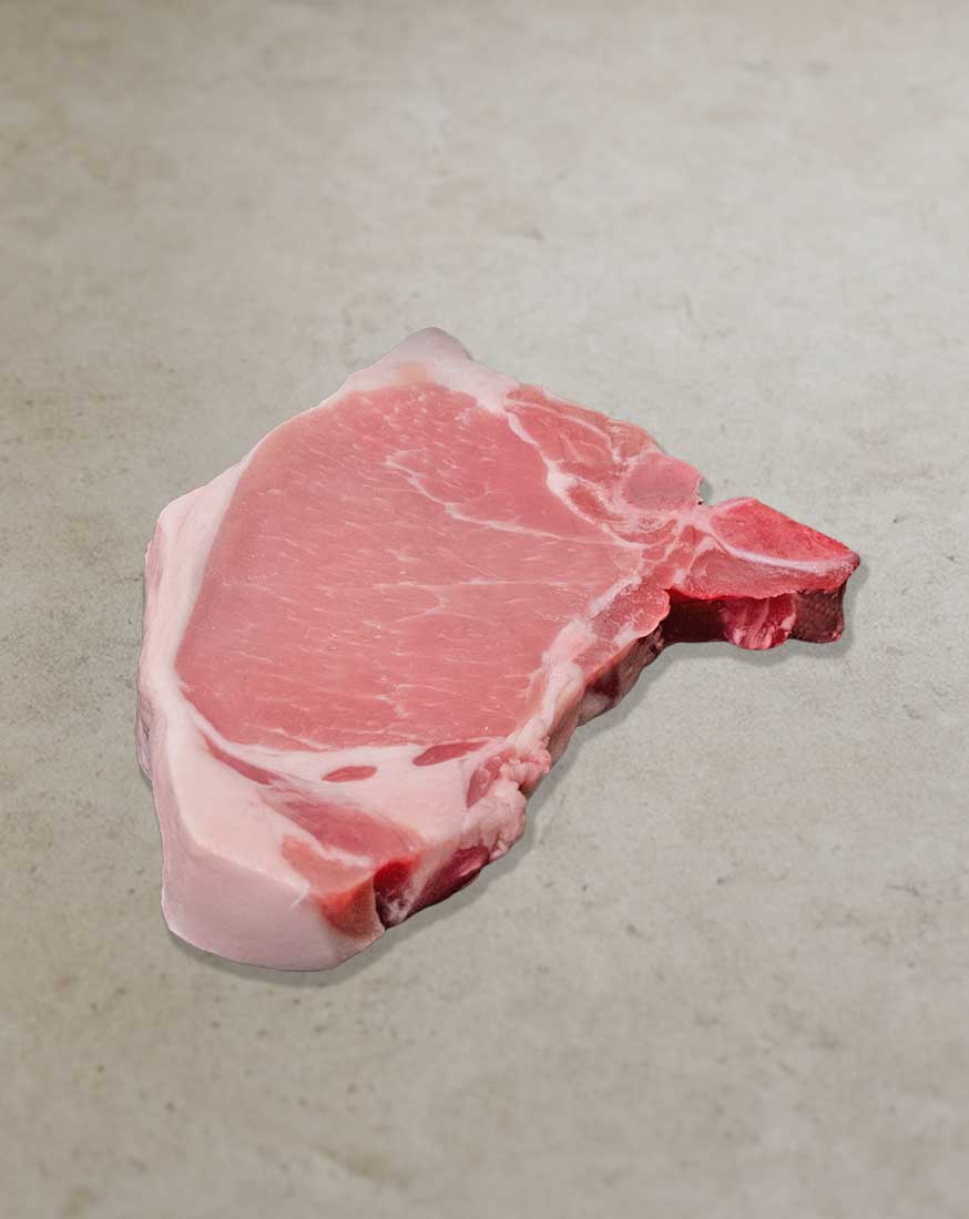 Michalski-Kotelett-vom-Landschwein Michalski Kotelett vom Landschwein mit Knochen und saftiger Fleischstruktur